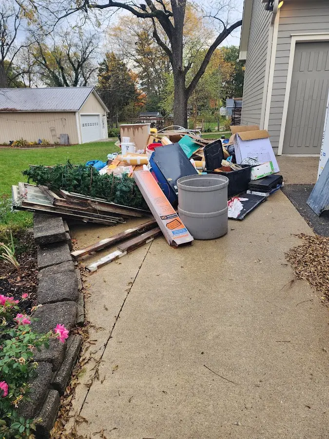 Dumpster being loaded with debris for 3 Yard Dumpster Rental in Sycamore